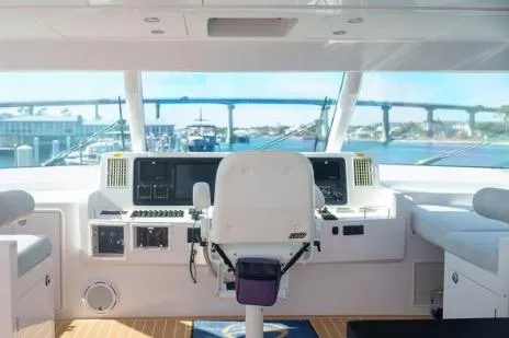 Slide: The Image of Cockpit of 2022 Horizon PC65 yacht with modern controls and panoramic view. - 15