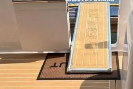 Slide: The Image of Horizon PC65 2022 yacht deck with ramp and welcome mat. - 26