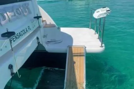 Slide: The Image of Horizon PC65 yacht with swim platform in clear turquoise water, Pensacola, FL, 2022 model. - 27