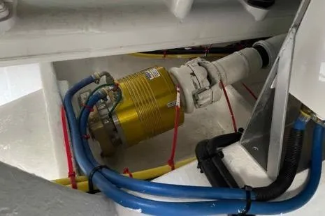 Slide: The Image of Engine compartment of 2022 Horizon PC65 with hydraulic components and blue hoses. - 28