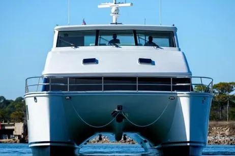 Slide: The Image of 2022 Horizon PC65 yacht on water, front view, clear sky background. - 3