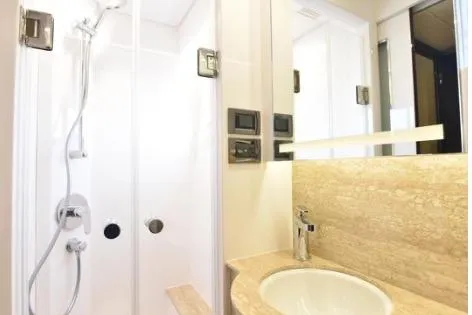 Slide: The Image of Modern bathroom in 2022 Horizon PC65 yacht with sleek shower and elegant sink. - 32