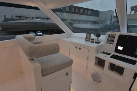 Slide: The Image of Interior of 2022 Horizon PC65 yacht with modern helm and seating area. - 35