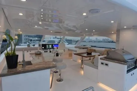 Slide: The Image of Luxurious 2022 Horizon PC65 yacht interior with modern kitchen and seating area. - 38