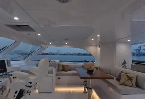 Slide: The Image of Luxurious interior of 2022 Horizon PC65 yacht with elegant seating and panoramic windows. - 40