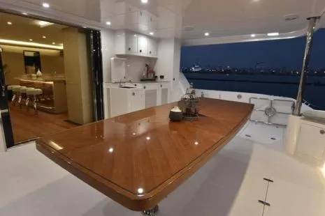 Slide: The Image of Luxurious 2022 Horizon PC65 yacht interior with elegant dining area and modern kitchen. - 43