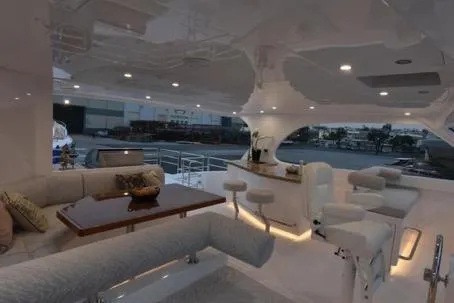 Slide: The Image of Luxurious 2022 Horizon PC65 yacht interior with elegant seating and modern bar area. - 46