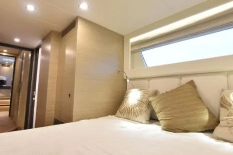 Slide: The Image of Luxurious bedroom interior of 2022 Horizon PC65 yacht with modern design and cozy bedding. - 48