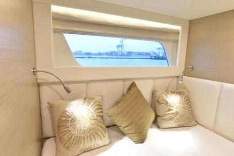 Slide: The Image of Luxurious cabin interior of 2022 Horizon PC65 yacht with elegant bedding and sea view. - 50
