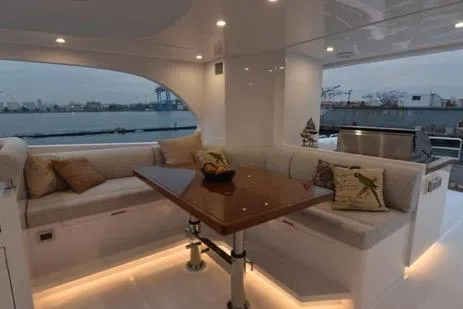 Slide: The Image of Luxurious 2022 Horizon PC65 yacht interior with elegant seating and waterfront view. - 51