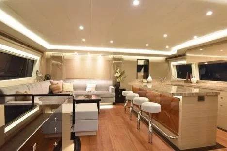 Slide: The Image of Luxurious interior of 2022 Horizon PC65 yacht with modern seating and elegant lighting. - 53