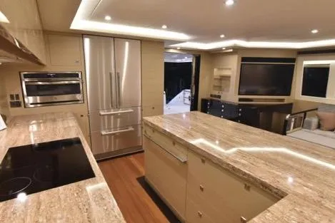 Slide: The Image of Luxurious kitchen interior on 2022 Horizon PC65 yacht with modern appliances and elegant lighting. - 57