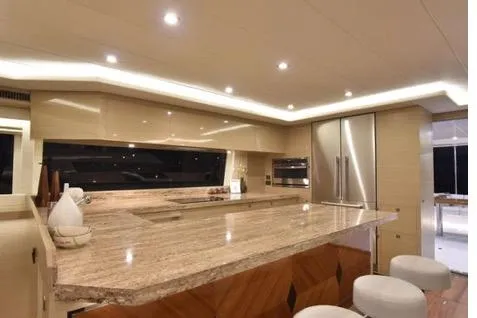 Slide: The Image of Luxurious kitchen interior of 2022 Horizon PC65 yacht with modern design and ambient lighting. - 60