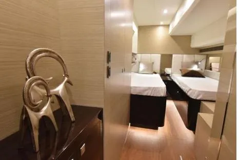 Slide: The Image of Luxurious cabin interior of 2022 Horizon PC65 yacht with elegant decor and twin beds. - 62