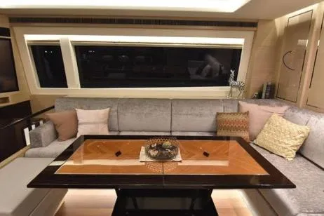 Slide: The Image of Luxurious interior of 2022 Horizon PC65 yacht with elegant seating and modern decor. - 63