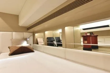 Slide: The Image of Luxurious interior of 2022 Horizon PC65 yacht with modern design and comfortable bedding. - 65