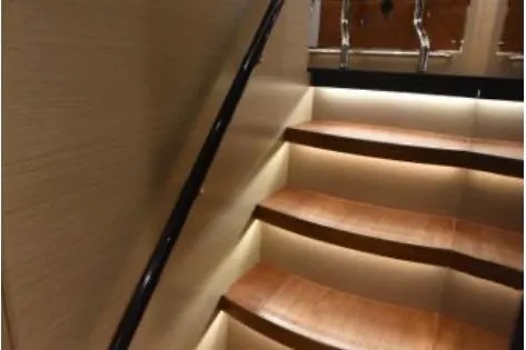 Slide: The Image of Staircase with ambient lighting in 2022 Horizon PC65 yacht interior. - 69