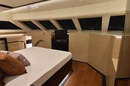 Slide: The Image of Luxurious bedroom interior of 2022 Horizon PC65 yacht with modern design and large windows. - 70