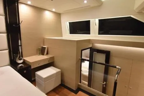 Slide: The Image of Luxurious interior of 2022 Horizon PC65 yacht with modern furnishings and elegant lighting. - 74