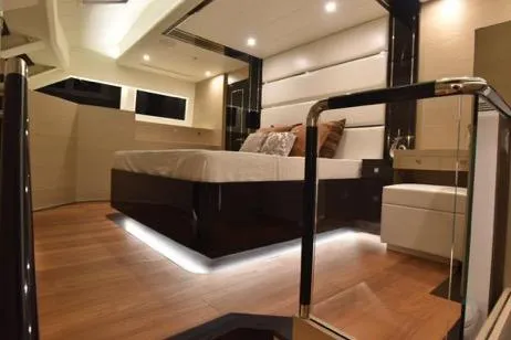 Slide: The Image of Luxurious interior of 2022 Horizon PC65 yacht with modern design and ambient lighting. - 76