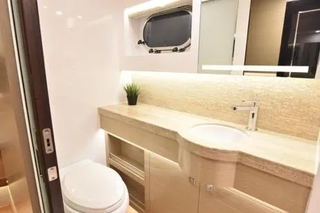 Slide: The Image of Luxurious bathroom in 2022 Horizon PC65 yacht with modern fixtures and elegant design. - 81