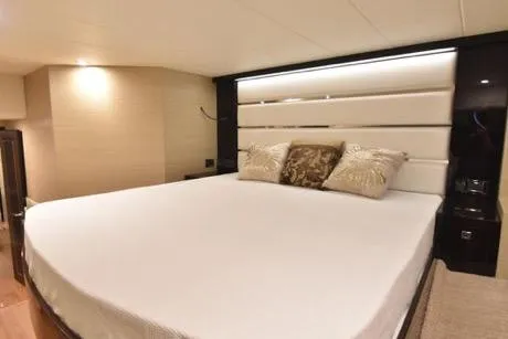Slide: The Image of Luxurious bedroom interior in 2022 Horizon PC65 yacht with elegant bedding and ambient lighting. - 84