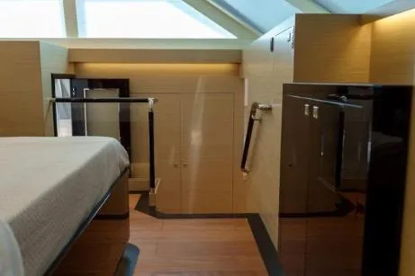 Slide: The Image of Luxurious interior of 2022 Horizon PC65 yacht with modern design and wooden accents. - 87