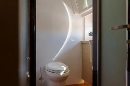Slide: The Image of Modern bathroom in 2022 Horizon PC65 yacht with natural light and sleek design. - 89