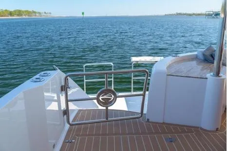 Slide: The Image of Luxury Horizon PC65 yacht deck overlooking serene ocean, 2022 model. - 9
