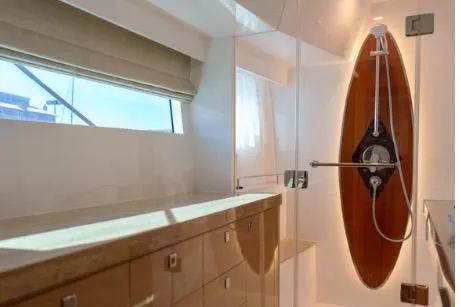Slide: The Image of Luxurious bathroom in 2022 Horizon PC65 yacht with modern shower and sleek cabinetry. - 92