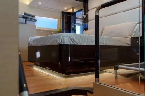 Slide: The Image of Luxurious bedroom interior on 2022 Horizon PC65 yacht, featuring modern design and ambient lighting. - 93