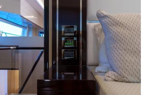 Slide: The Image of Luxury interior of 2022 Horizon PC65 yacht with modern control panel and plush bedding. - 95