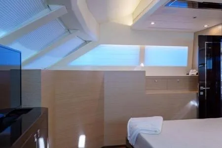 Slide: The Image of Luxurious cabin interior of 2022 Horizon PC65 yacht with modern design and ambient lighting. - 96