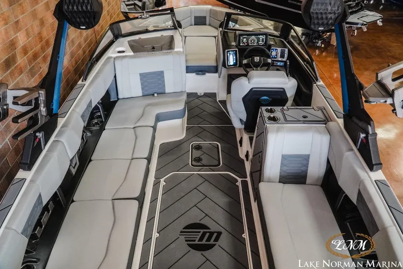 Slide: The Image of 2023 Malibu Wakesetter 25 LSV interior with sleek seating and advanced dashboard controls. - 11