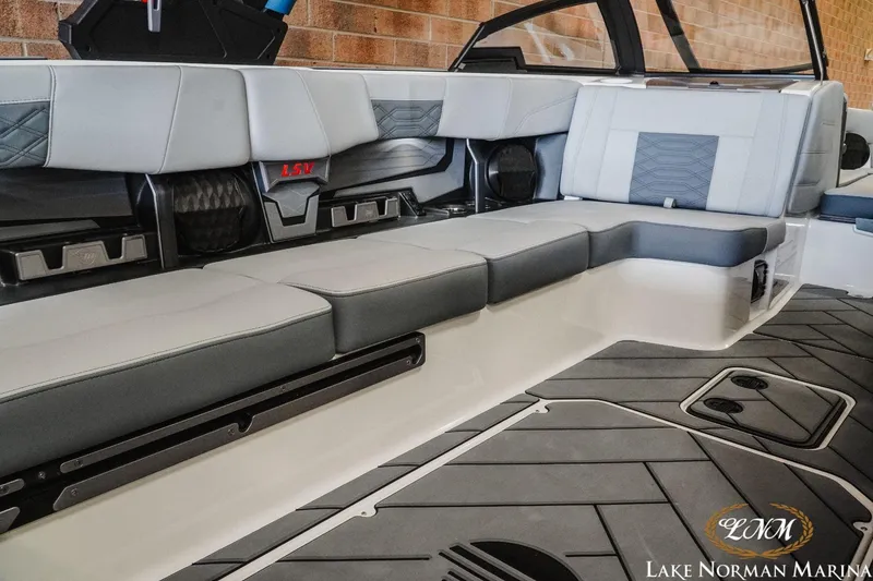 Slide: The Image of 2023 Malibu Wakesetter 25 LSV interior with luxurious seating and modern design. - 19