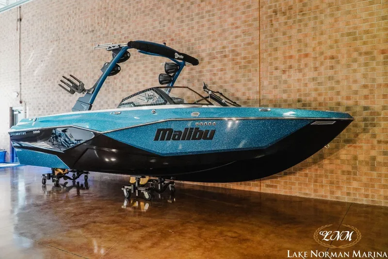 Slide: The Image of 2023 Malibu Wakesetter 25 LSV boat displayed indoors at Lake Norman Marina. - 3