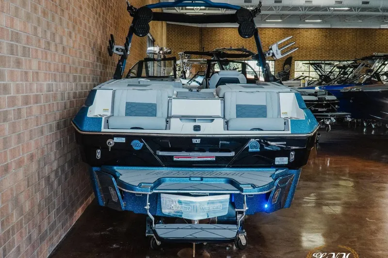 Slide: The Image of 2023 Malibu Wakesetter 25 LSV boat displayed indoors, rear view. - 5