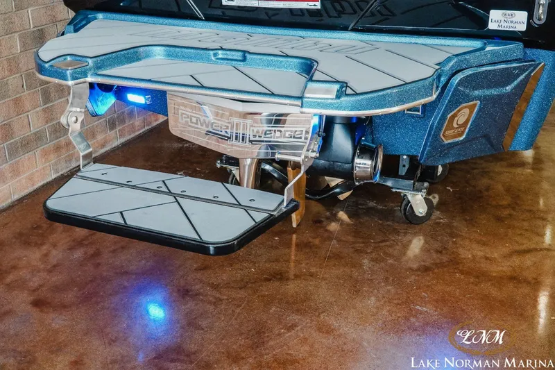 Slide: The Image of 2023 Malibu Wakesetter 25 LSV boat with Power Wedge, displayed at Lake Norman Marina. - 6