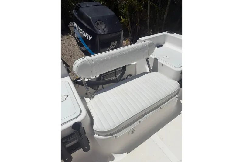Slide: The Image of 2006 Sea Fox 187 Center Console boat interior with Mercury engine and white seating. - 10