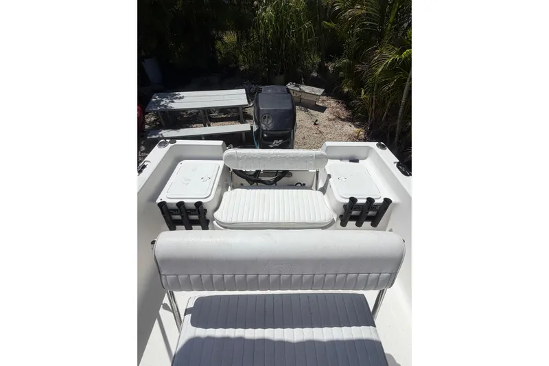 Slide: The Image of 2006 Sea Fox 187 Center Console boat interior with seating and storage compartments. - 11