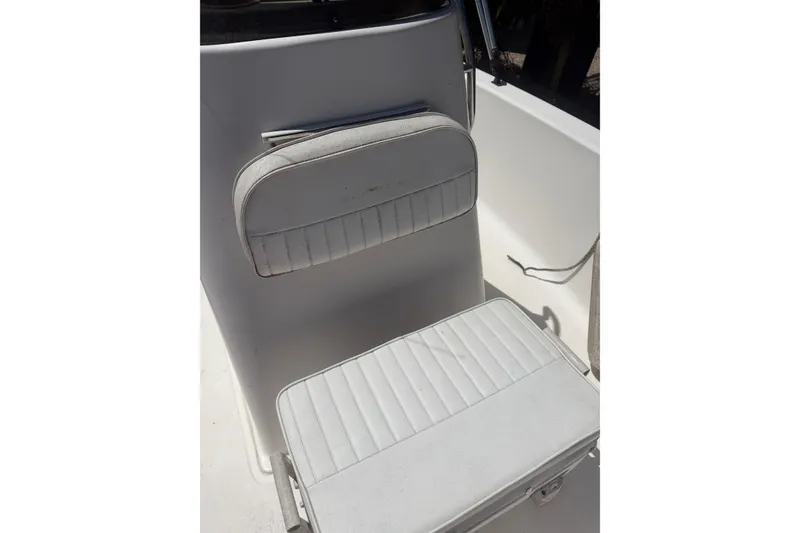 Slide: The Image of 2006 Sea Fox 187 Center Console boat interior with white cushioned seating. - 17