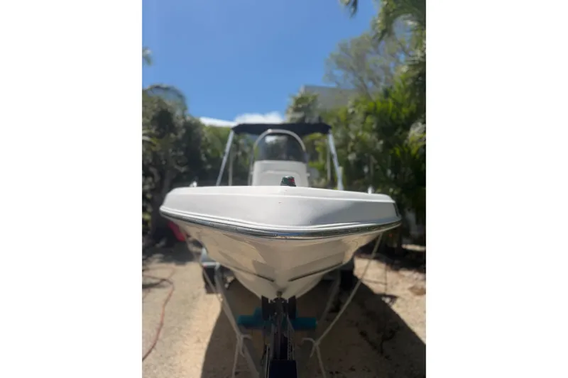 Slide: The Image of 2006 Sea Fox 187 Center Console boat in a sunny outdoor setting. - 2