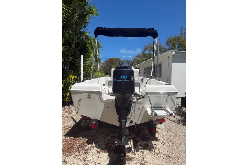 Slide: The Image of 2006 Sea Fox 187 Center Console boat with outboard motor, parked outdoors. - 5