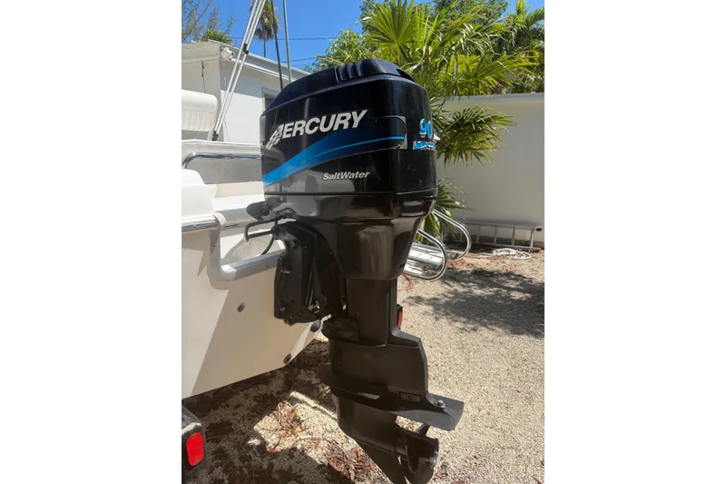 Slide: The Image of Mercury outboard motor on 2006 Sea Fox 187 Center Console boat, parked outdoors. - 8