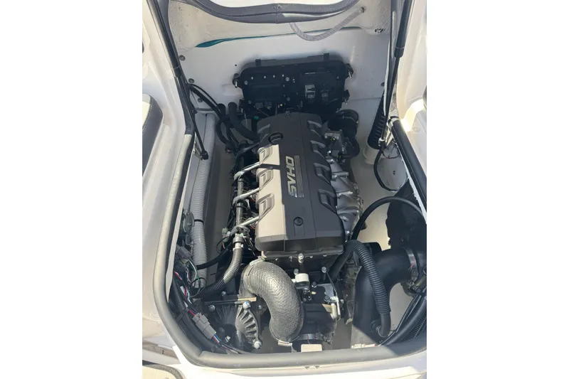Slide: The Image of Engine compartment of a 2026 Yamaha Boats 195S, showcasing the powerful engine setup. - 11
