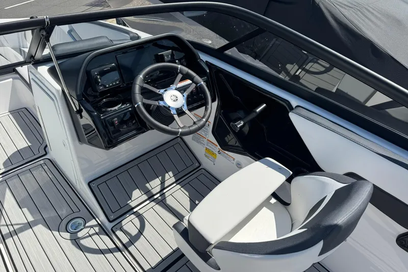 Slide: The Image of 2026 Yamaha Boats 195S cockpit with modern steering wheel and sleek dashboard design. - 7