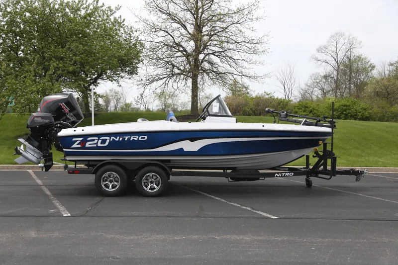 The Image of 2026 Nitro ZV20 boat on trailer in parking lot, side view. - 0