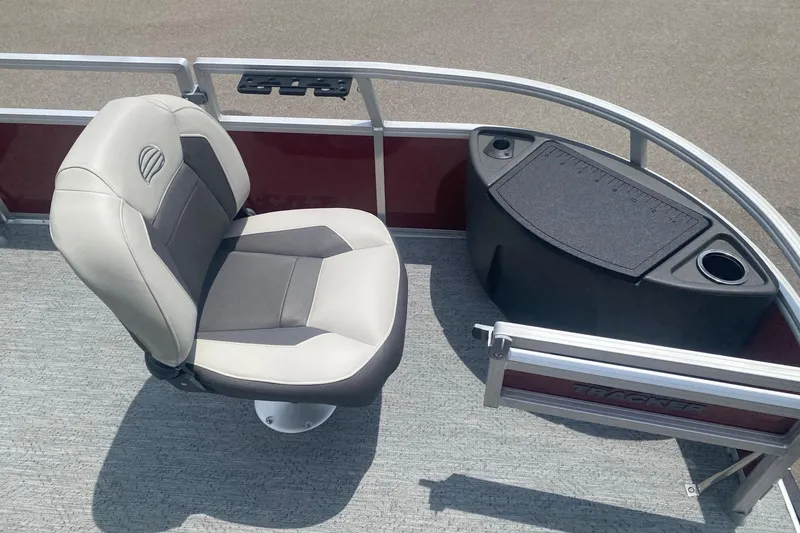 Slide: The Image of 2026 Sun Tracker Bass Buggy 18 DLX boat seat and console with cup holder. - 8
