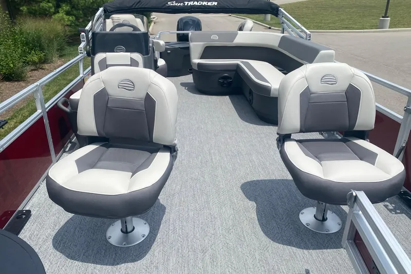 Slide: The Image of 2026 Sun Tracker Bass Buggy 18 DLX pontoon boat interior with comfortable seating. - 4