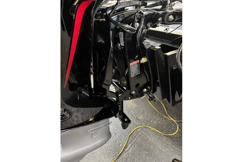 Slide: The Image of 2026 Ranger Z518 boat engine compartment with visible wiring and components. - 10